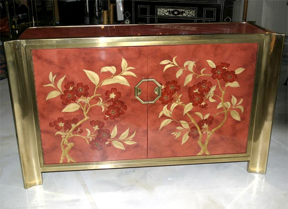 This Chinois cabinet is a perfect accent to any room. The floral pattern in the cabinet has greater detail than the images dipict.