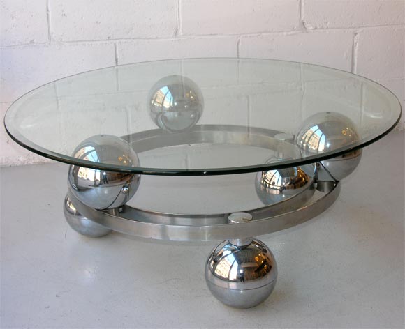 german coffee table with spherical base in chrome and beveled glass top, c. 1950.