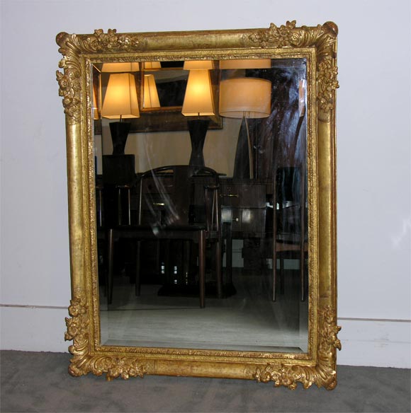 A fine Baroque frame now fitted with a beveled mirror.