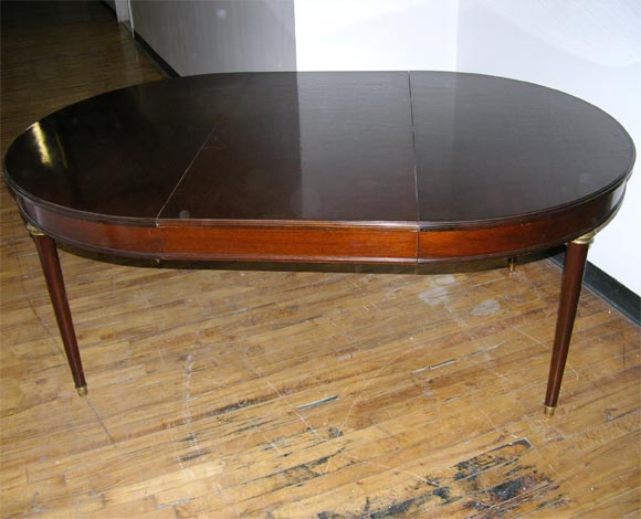 Bronze mounted mahogany dining table by Jansen