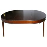 Bronze mounted mahogany dining table by Jansen