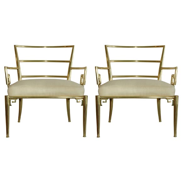 pair of brass lounge chairs