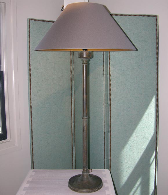 A pair of brass candlestick lamps