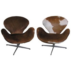 Pair of Pony Skin Swan Chairs by Arne Jacobsen