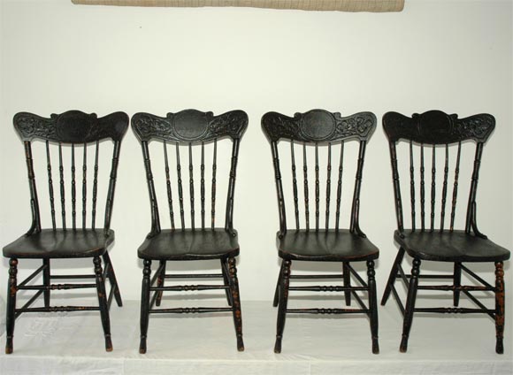 WONDERFUL SET OF FOUR ORIGINAL BLACK PAINTED PRESSED BACK CHAIRS,WITH GREAT OLD SURFACE AND IN PRISTINE CONDITION WITH EMBOSSED LEAF PATTERN ON IN SIDE TOP OF CHAIR