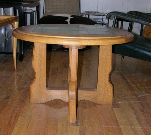 Oak round coffee table with green and black checkerboard ceramic inlay top.
