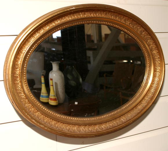 Oval giltwood mirror, deepset frame, gold painted, can be used horizontally or vertically
