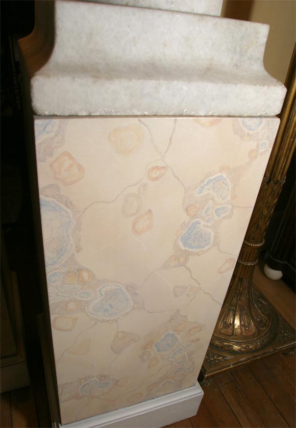 Carved Pair of White Granite Urns on Faux Marble Pedestals For Sale