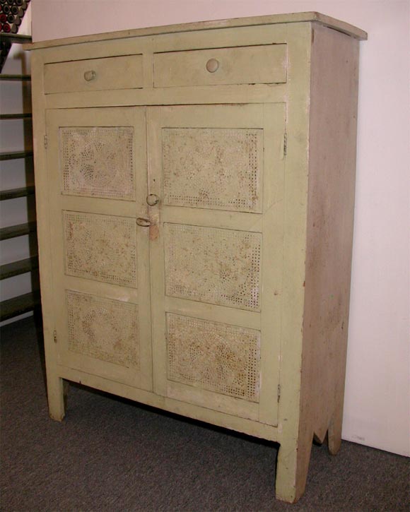 19THC ORIGINAL PAINTED TWO DRAWER OVER TWO DOOR PIE SAFE FOUND IN  THE MIDWEST GREAT  SOFT GREEN OVER OLD WHITE ,WHITE SIDES PUNCHED TINS WITH STARS  WONDERFUL DRY SURFACE
