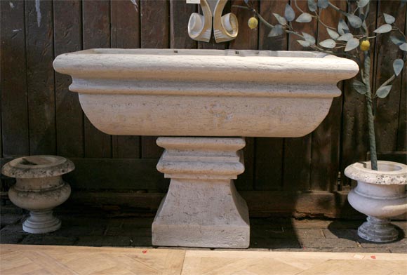 Three piece fountain. Carved marble back piece(not shown)carved with opening for faucet, basin, and pedestal.