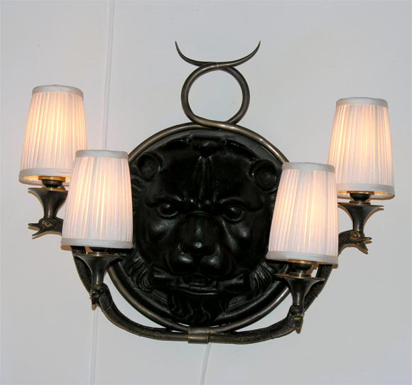 Four Light Iron and Bronze Wall Sconce with Lion's Head Decor