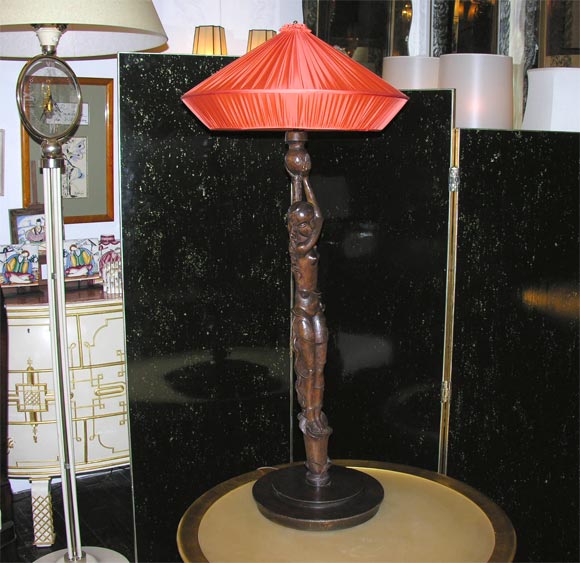 German carved-wood table lamp in the shape of woman with custom, coral-color silk shade
