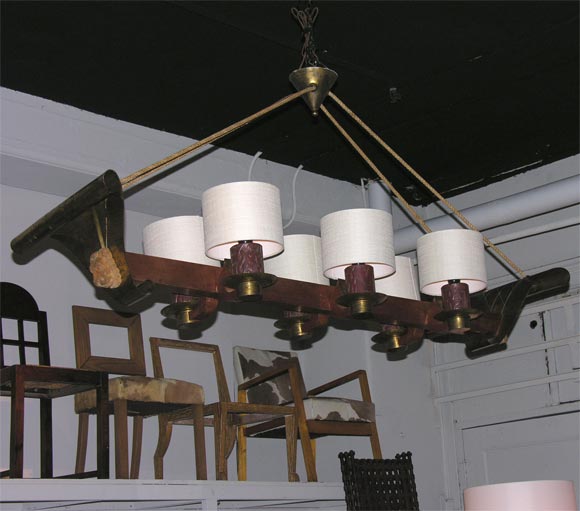 Rustic chandelier with carved figures and matching sconces