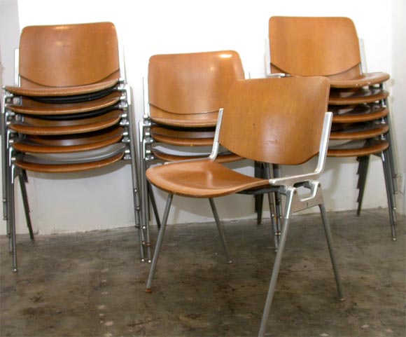 16 Italian bent plywood and aluminum chairs, designed by castelli. will sell in set of 8.