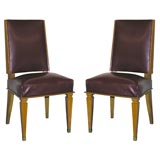 Set of 12 Dining Chairs by Jacques Adnet