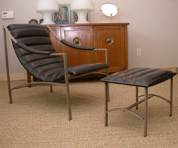 Beautiful sculptural chair and ottoman. Made in Italy tag on underside