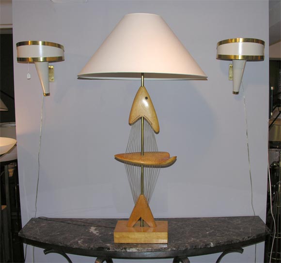 A sculptural table lamp of abstract fish wood and filament  
by Clark Voorhees
New sockets and rewired
Shade not included