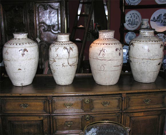 Four Early Chinese brown and white glazed storage pots