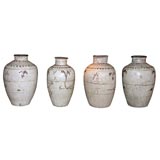 Four Early Chinese brown and white glazed storage pots