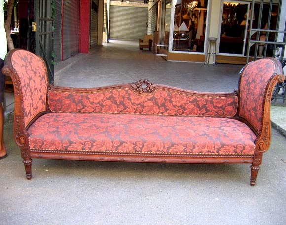 Luois XVI style settee in stained beech. Carved decorations. Very high ends with curved top of 93 cm in height.