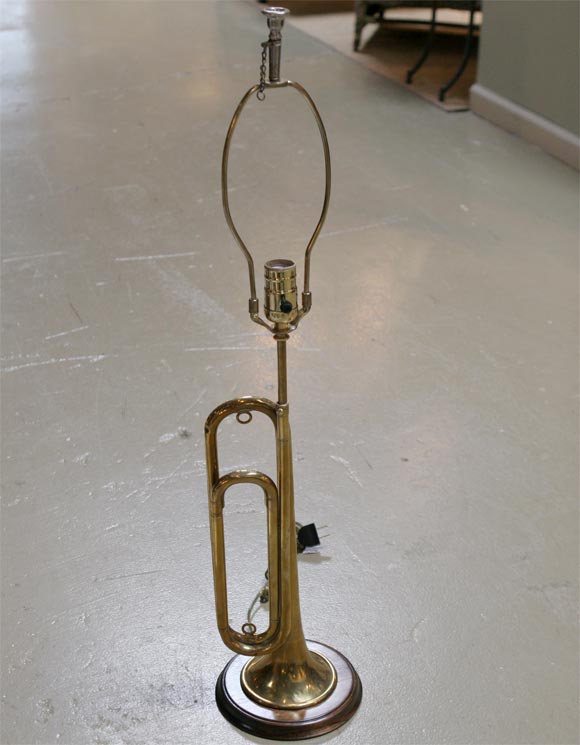 Signed US Army Regulation.  This lovingly worn bugle was too good to part with so someone made it into a lamp!  A compliment to any study, library, great for the little or big boy in your life. This lamp has a sense of history and humor.  The mouth