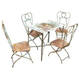 An Argentine Iron Garden Table & Four Chair Set