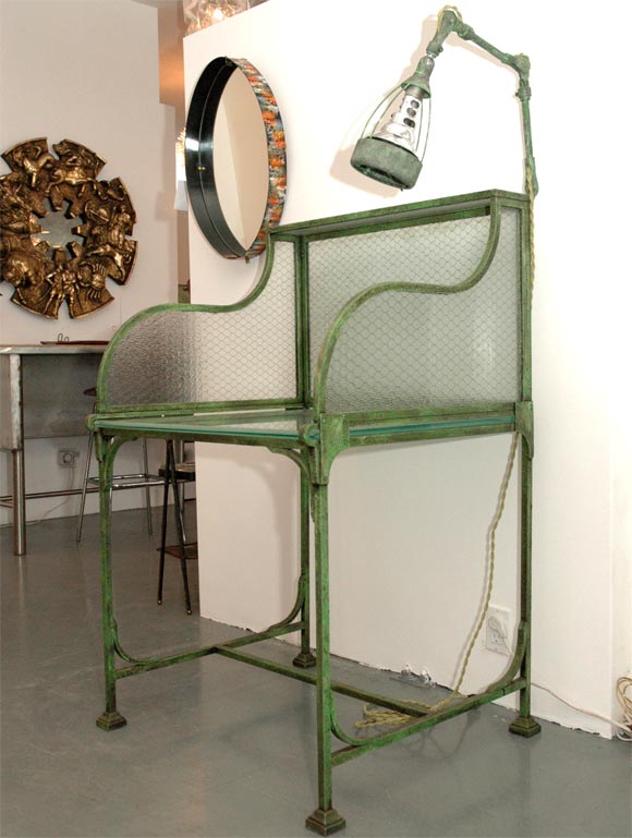 Iron Flower Table with original Glass.  Great to be used as a hostess stand. Has vintage industrial light attached to back.