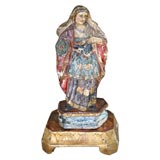 Polychrome statue of a female saint.