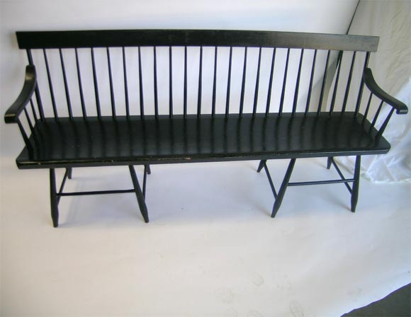 This 19th century meeting house bench is in the Windsor style,it has 24 spindals and is painted black.