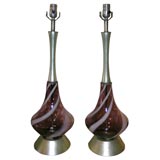 PAIR OF SWIRLED  GLASS LAMPS WITH METALLIC LEAFED NECK AND BASE.