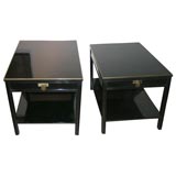 PAIR OF BLACK LACQUERED END TABLES WITH BRASS APPOINTMENTS.