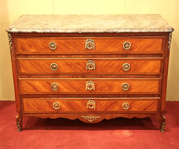 Very fine 18th century French Louis XV/XVI transition period marquetry four drawer commode with bronze doré mounts and 