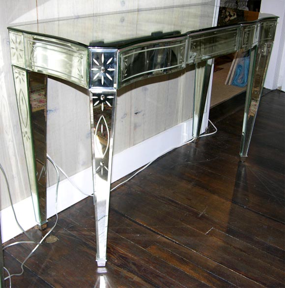 Beautifully made Venetian 3-drawer mirrored console. The console is mirrored on all sides including the back. The mirror is both etched and beveled.
