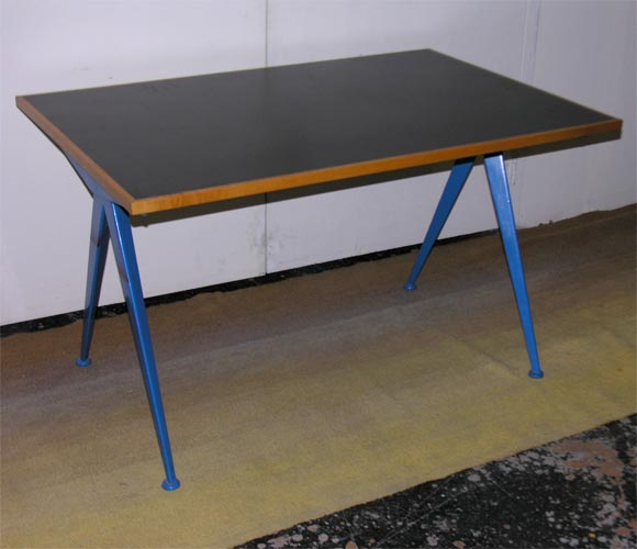 This table base, also used as a desk, was painted blue and has a new laminate top. Another available in it's original condition.