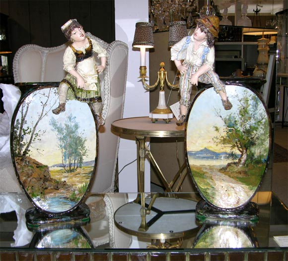 Exceptional pair of French art pottery vases with childrens figures. The vases are beautifuuly finished on both sides.