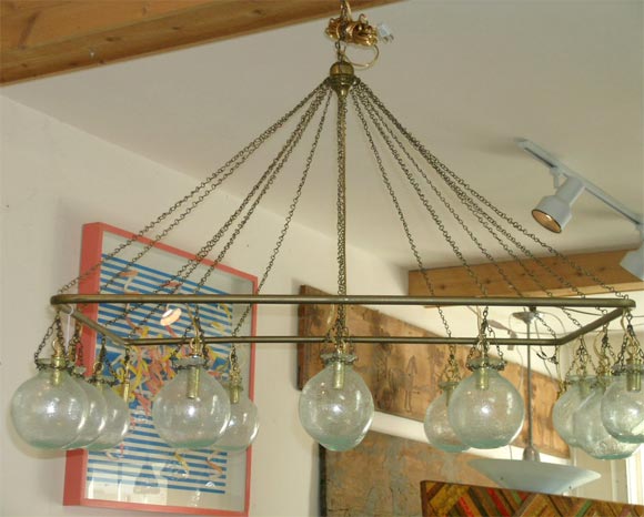Egyptian rectangular frame chandlier with twelve handblown glass balls.  Already electrified.