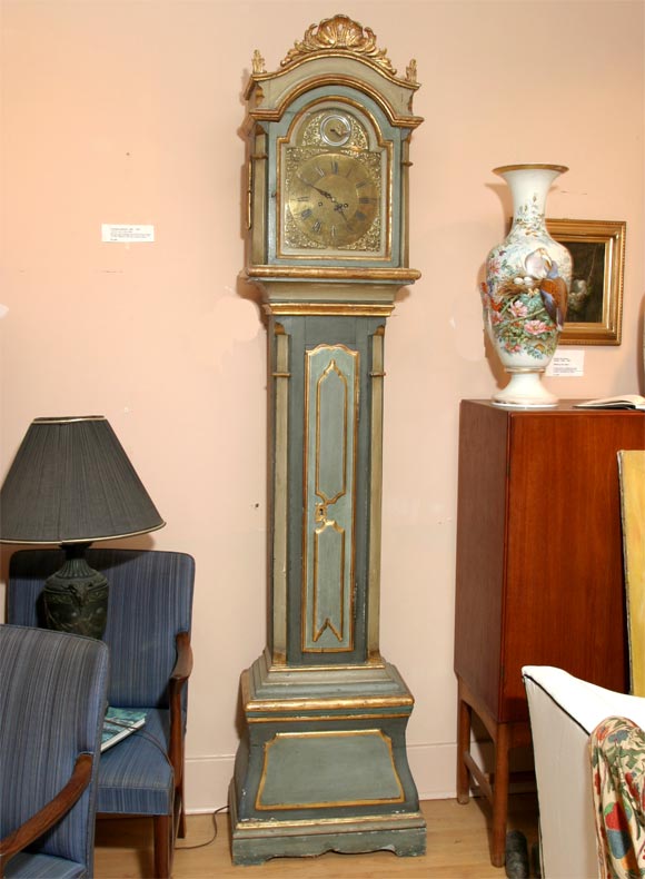 Handsome painted long case clock from South Jutland in Denmark with brass face and small bird detail depicting second hand. Painted in pale grey-green and gold and gilded. Strikes on the hour and half-hour, runs 8 days. In good working condition.