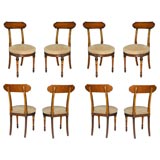 Eight  Carved Wood Dining Chairs.