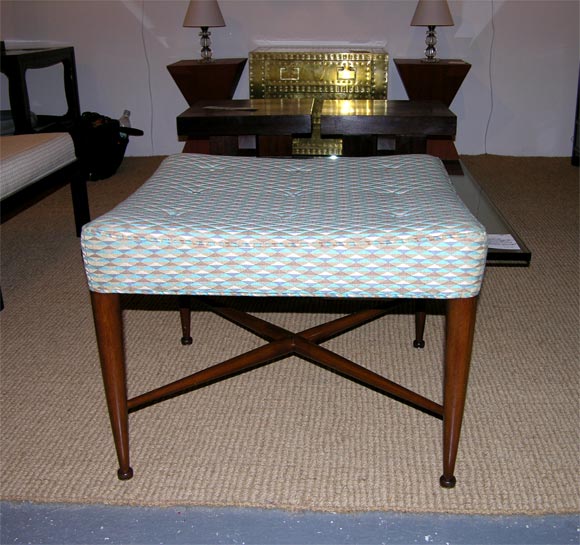 A pair of square upholstered benches with buttoned and rubber-filled seat, mahogany legs and stretchers, model no. 5002, by Edward Wormley for Dunbar. American, circa 1950.