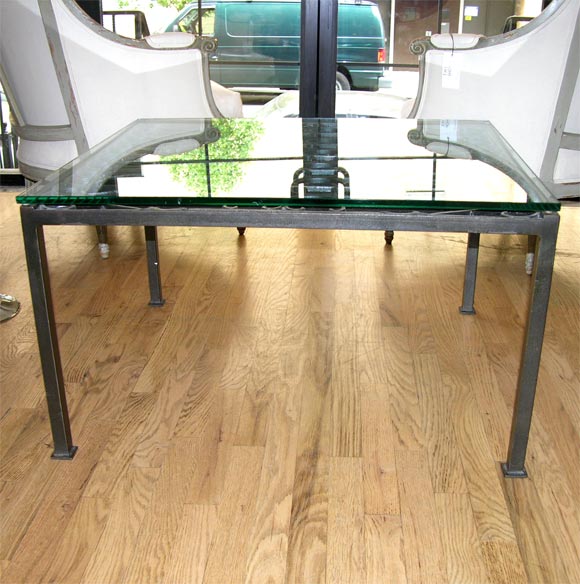 Beautiful scrolled top welded on rectangular base with square legs.