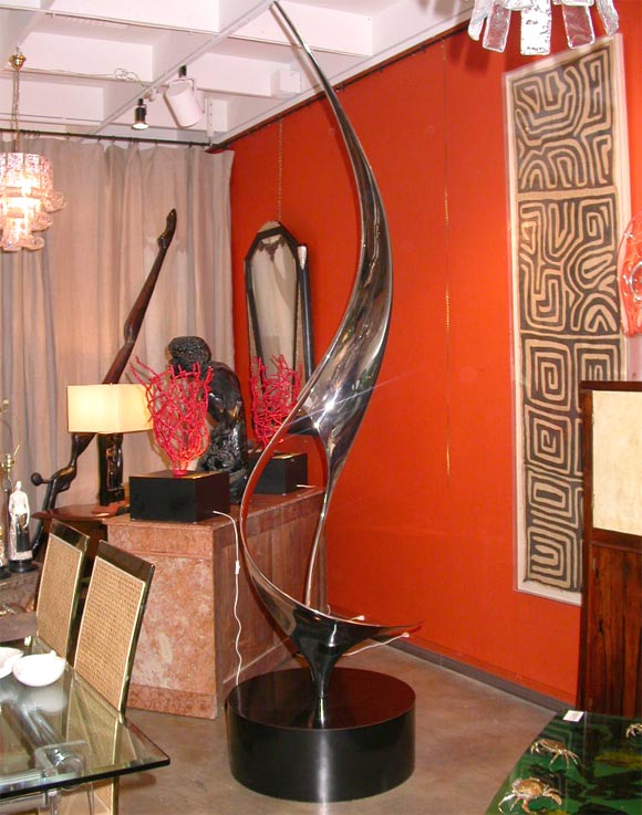 An Impressive nichel plated Stainless steel sculpture setting on a black formica circular base.<br />
The Artist :Louis Pearson(American School-20th century)<br />
inscribed, titled numbered and dated:<br />
Louis Pearson,-1/6 ,6-29-1990<br