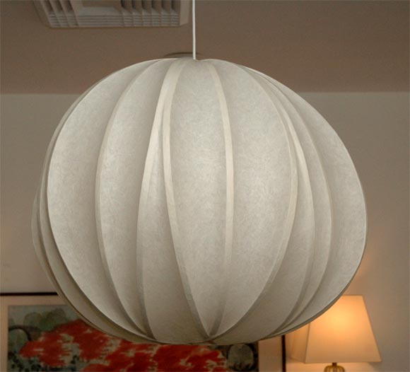 Paper mache over bamboo strapping.  This light is a custom piece signed and numbered by the artist himself.  A quote for this light must be requested and the size may be adjusted as needed.  Lead time is 14-16 weeks.  Every light will vary slightly
