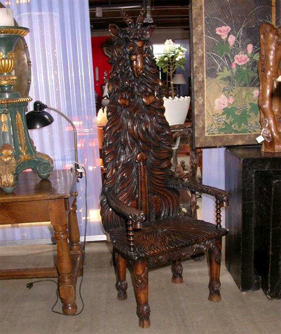 Hand Carved chair by Aleistar Crowley possibly depicting Baphomet, a half-male / half female deity.