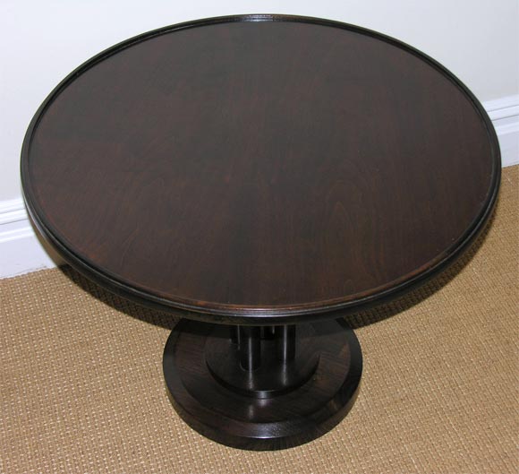 Mid-20th Century An Art Deco Round pedestal Base Walnut Table.