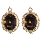 Antique Pair of 18th Century "Carton Pierre" Oval Gilt Mirrors