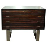 Chest of drawers in ebony, chrome and rosewood.