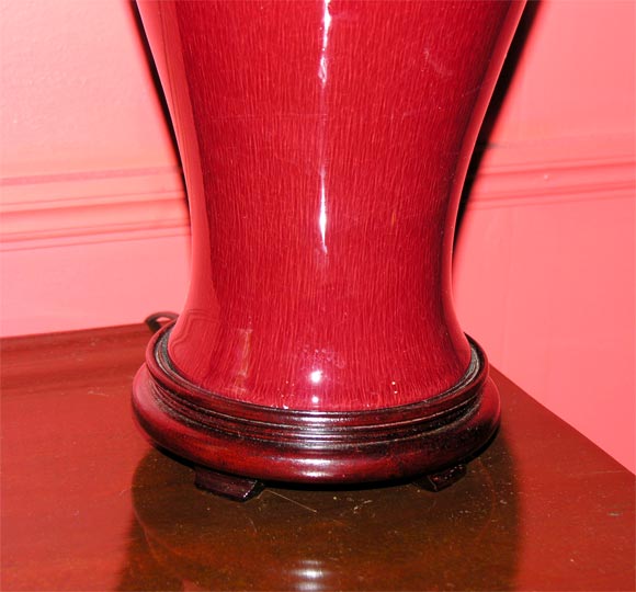 20th Century Pair of ox-blood fish-tail vase lamps.