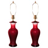 Pair of ox-blood fish-tail vase lamps.