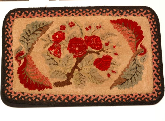 19th century hand-hooked rug with braided edge border. Pristine condition, circa 1880-1890. Great vibrant colors.