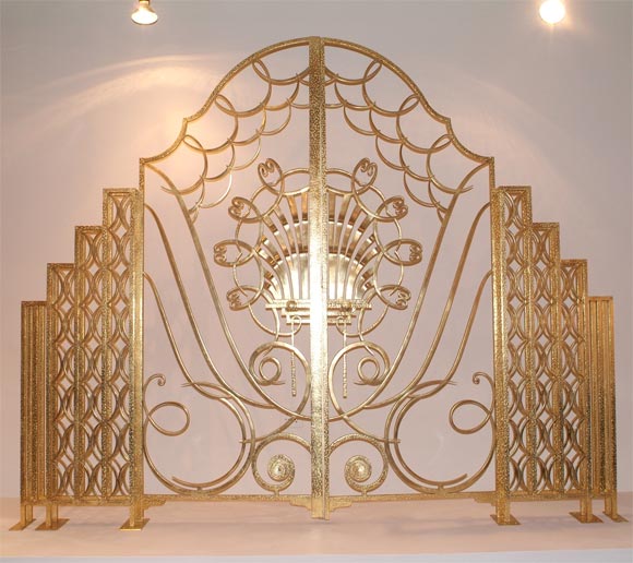 Commissioned by the French government, these 22kt gilded gates were in the Salon MIxte, also called the Salon de Thé.  They were designed by Raymond Subes, one of the most important and renowned French Deco metalwork designers in history.<br />
<br